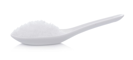 sea salt in white spoon isolated on white background