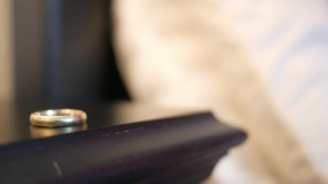 Married man takes his ring off during an affair