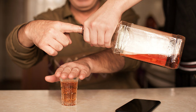 Man Saying No More To Alcohol With His Body Language