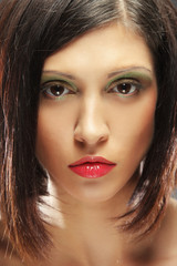 young brunette woman close-up portrait, bright make up