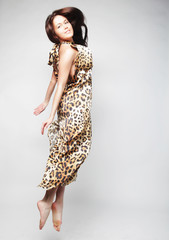 Fototapeta premium happiness, freedom and people concept - smiling young woman jump