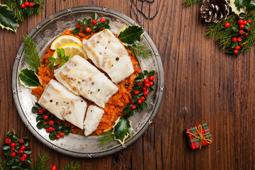 Christmas fish. Roasted cod pieces, served in vegetable sauce.