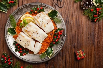 Foto op Plexiglas Christmas fish. Roasted cod pieces, served in vegetable sauce. © gkrphoto