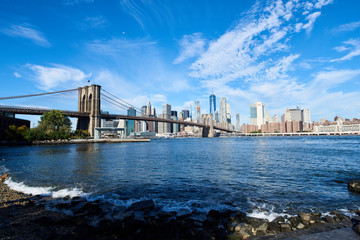 Lower Manhattan and Brooklyn bridge seen from Brooklyn Bridge park in Brooklyn, New York.