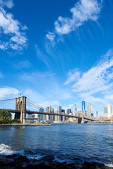 Fototapeta na wymiar Lower Manhattan and Brooklyn bridge seen from Brooklyn Bridge park in Brooklyn, New York.