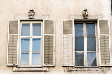 Fototapeta na wymiar Windows on the Exterior Wall of a Rresidential Building with Business Premises in Nancy, France
