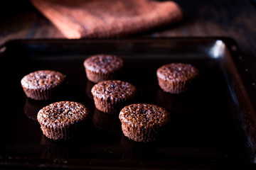 Mini Chocolate Cake Souffle on wooden surface.