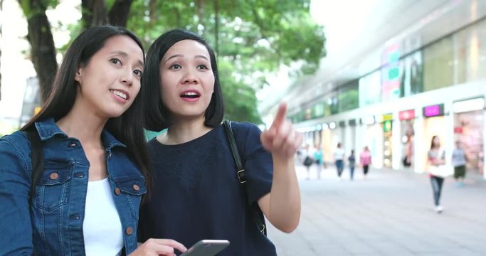 Girl Friend looking for a shop on cellphone together