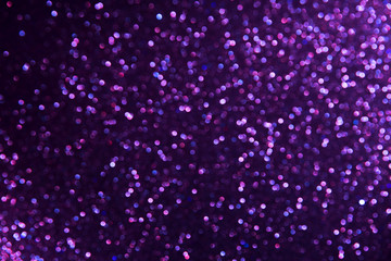Obraz premium Purple abstract bokeh background with defocused lights christmas