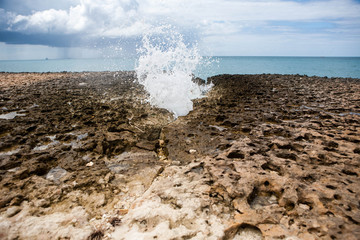 Sea water spurt between coral formation