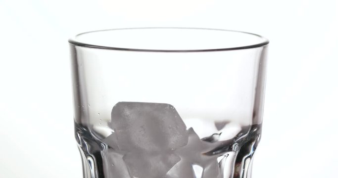 Put iced cube into glass