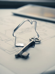 House shape with a key on construction plan