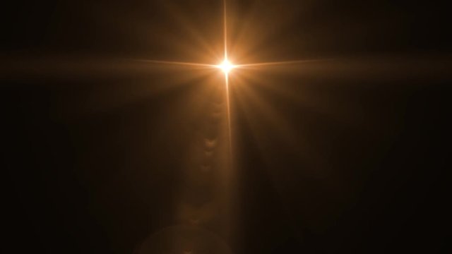 Abstract lens flare light over black background