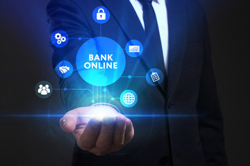 Business, Technology, Internet and network concept. Young businessman working on a virtual screen of the future and sees the inscription: Bank online