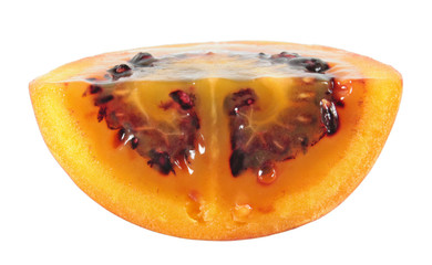 Slice of tamarillo (tree tomato) fruit isolated on white background