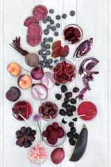 Health food of fruit and vegetables high in anthocyanins, antioxidants and vitamins of red, purple and blue foods. Healthy eating concept. Top view. © marilyn barbone
