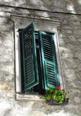 Fototapeta na wymiar Old, wooden window of Mediterranean cities