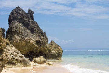 Fototapeta na wymiar Rocks and ocean view in wild beach of Bali, Indonesia