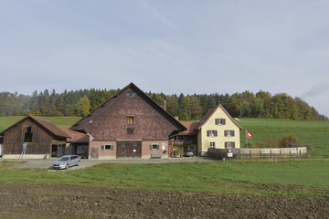 Fototapeta premium Appenzell Innerrhoden/St. Gallen, Switzerland - 28 October 2017: Autumn landscape at the village of Swiss alps Switzerland