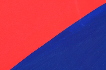 Abstract painted wall with red and blue