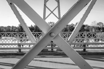 Isolated steel support beams of outdoor bridge. Industrial bridge construction joint details.