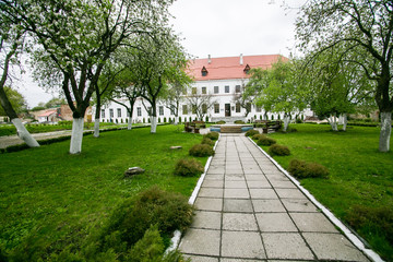 Well-preserved old building with garden and green alley at the Dubno