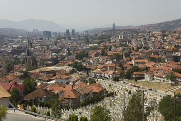 Fototapeta na wymiar View from the top of Yellow Fortess of the city of Sarajevo, with a huje war cemetery in the foreground