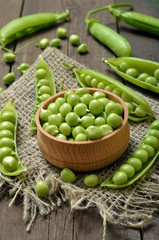 Ripe pods of green peas, fresh green peas
