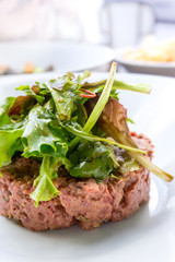 tasty Steak tartare (Raw beef) - classic steak tartare on white plate