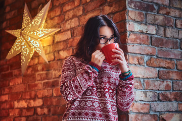 A woman drinks coffee.