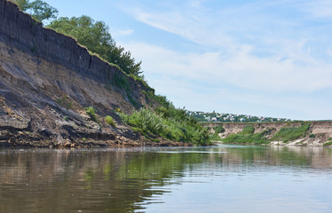 The river goes around a steep bank.