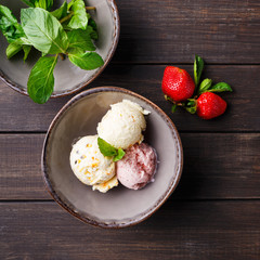 Assorted ice cream scoops in bowl top view