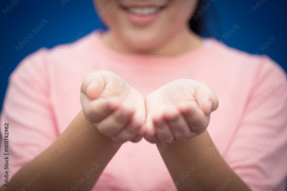 Wall mural girl teen smile hand open palm ask giving or help concept