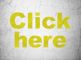 Web development concept: Yellow Click Here on textured concrete wall background