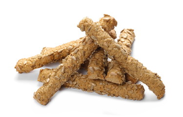 Integral bread sticks with sunflower seeds isolated on white background