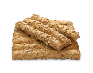 Integral bread sticks with sunflower seeds isolated on white background