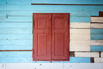Old wood window on wooden wall