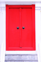 Closed Up of Vintage Chinese Lion Door Knocker on Red Wooden Doo