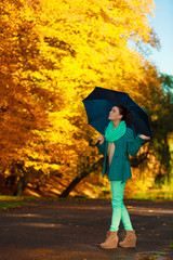 Woman walking in park during autumn