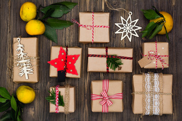 Many decorated Christmas presents on wooden background
