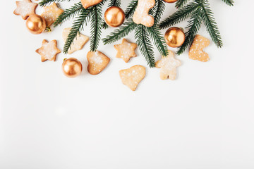 Christmas decoration.Gingerbread,fir branch,golden balls.Holiday,new year,Christmas  concept.White background.Top view,flat lay.