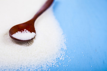 Wooden spoon with sugar