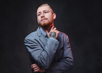 A man dressed in a suit over grey background.