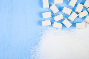 White sugar and cubes of sugar