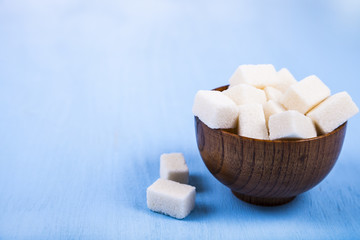 Sugar in a wooden bowl