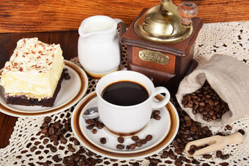 Fototapeta na wymiar black coffee in a cup with chocolate cake