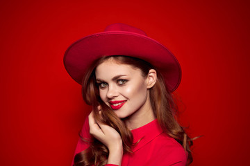 beautiful woman posing on red background