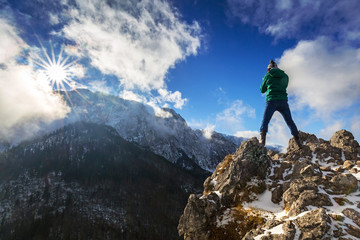 Hiker standing on the top of a hill in Tatra mountains, Poland