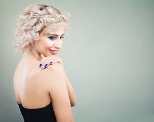 Naklejka premium Cute Blonde Woman with Curly Bob Hairstyle and Makeup on Background