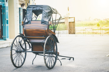 Fototapeta na wymiar Tugging-cart old antique two-wheel used to receive - send people.